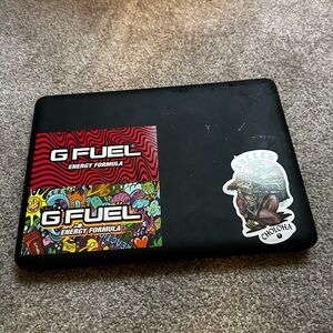 Apple Laptop in Black with Stickers